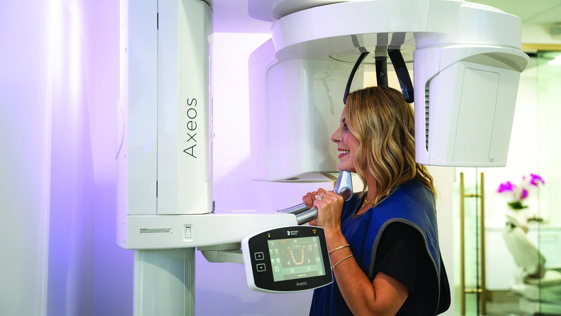 Patient undergoing 3D CBCT imaging for dental implant planning